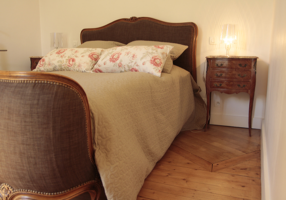 On the first floor, the bedroom, very luminous overlooks the owners’ house and their garden